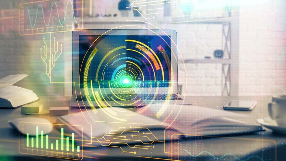 What is artificial intelligence featured image with laptop and open book on the table